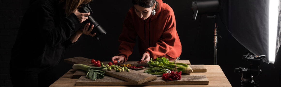 photographers making food composition for commercial photography and taking photo on digital camera, panoramic shot