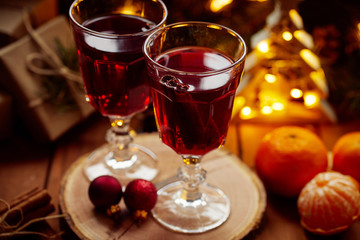 Close up of two glasses of hot mulled wine on Christmas table