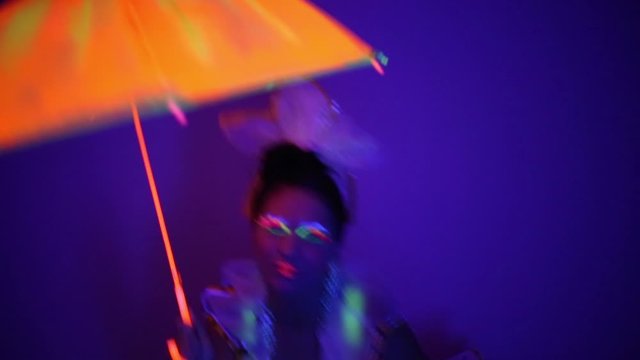 Girl in neon dancing costume