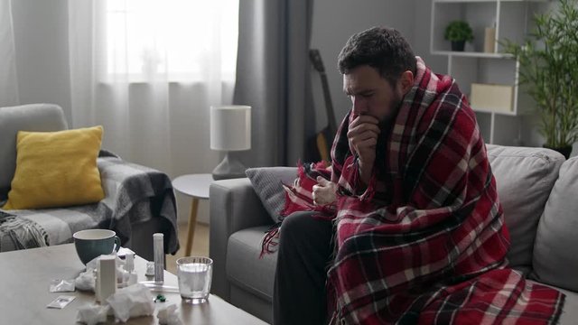 Sick man drinks effervescent cough pill