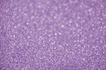 Abstract festive liliac bokeh background with shining defocus sparkles. Blurred glitters shimmering dust macro close up, copy space for text logo