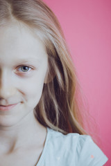 little girl blonde on a pink background