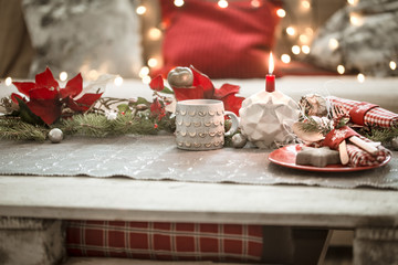 Beautifully decorated Christmas table in the living room.