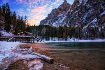 winter sunrise over Lago di Braies, Dolomites, Italy