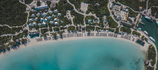 Drone shoot of sandy beach and set up with beautiful blue water 