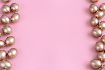 Background with Easter eggs in gold color.
