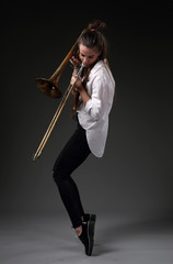 Girl dancing with trombone