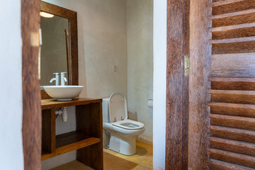 Fototapeta na wymiar Interior of modern bathroom in tropical style of luxury villa on the island of Zanzibar, Tanzania, Africa