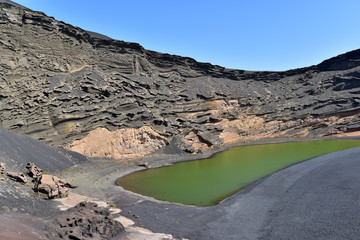Lago Verde (Green Lake) is a green lagoon on the crater wall near the town of El Golfo, Lanzarote, Canary Islands, Spain