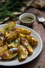 baked potatoes with sauce and herbs