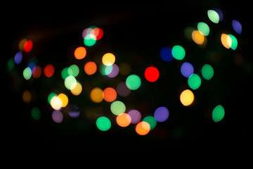 blur light bokeh color red green yellow on background black.