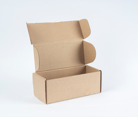 Open empty cardboard box on white background.
