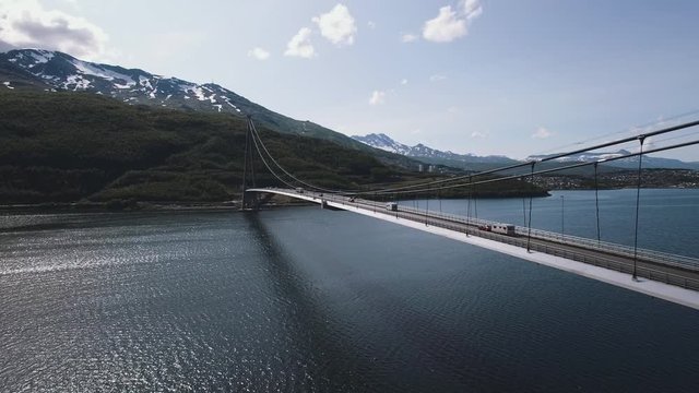 Aerial View Of A Suspension Bridge In The Arctic. Nature, Infrastructure, Travel Concept. Location: H&aring;logaland Bridge, Rombaken Fjord, Norway. July Of 2019. 