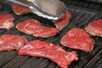 Raw steak on the grill, close up