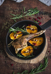 baked chicken leg with orange, cranberry and rosemary