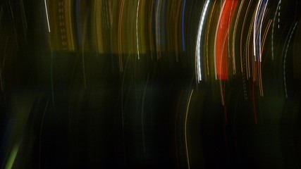 . Light trails captured at night as pure abstract images. From a linear motion blur of moving...