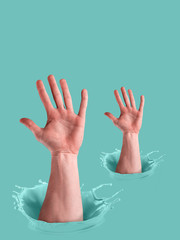 Obraz premium Ink splashes. Pastel turquoise paint. Male hands showing open palms gesture in paint. Voting concept.