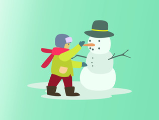 Boy build a Snowman with Hat