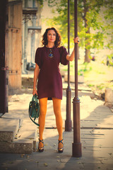 woman in a fashion burgundy dress