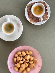 cup of coffee and cookies on wooden table