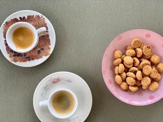 cup of coffee and cookies on wooden table