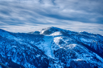 Fototapeta na wymiar beautifully snowy mountains with clouds, slovakia Mala Fatra