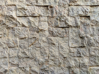 Modern and good looking white stone rock bricks on an outside wall as interesting decoration style