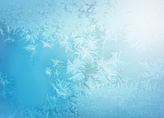 Fototapeta na wymiar Frost ice patterns on winter window