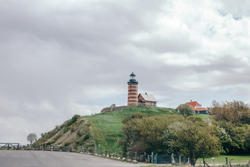 Fototapeta na wymiar Old lighthouse on a hill in Denmark