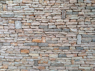 Modern style of horizontal stone rock bricks making an interesting wall made of natural material for good looking exterior facade