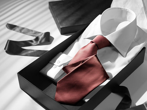 A Shirt And Tie Inside The Gift Box