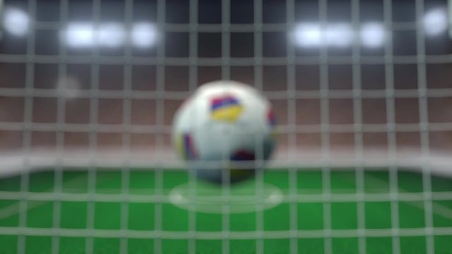 Football with flags of Colombia hits goal net. Slow motion 3D animation