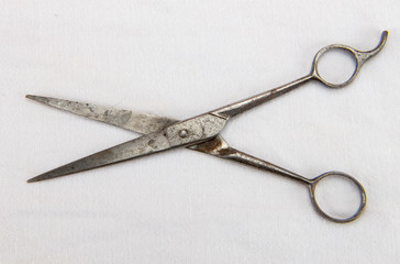 Antique Rusty Scissors on White Denim