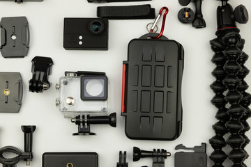 Extreme camera and a set of accessories necessary for it on a white background.