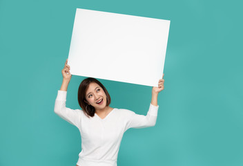 Young attractive asian woman showing and holding blank white board, Showing empty board for input...