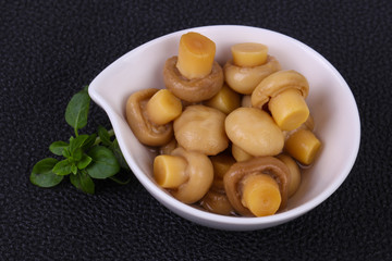 Pickled champignon heap in the bowl