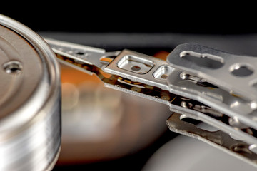 Disassembled hard drive from the computer, hdd with mirror effect. Opened hard drive from the computer hdd disk drive with mirror effects. Part of computer pc, laptop.