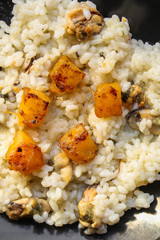 risotto mussels, pumpkin (main course, rice seafood) menu concept. food background. top view. copy space