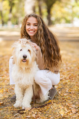 Portrait of a beautiful woman with dog.