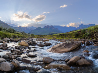 Mountain stream and rocks at sunset © hannesthirion