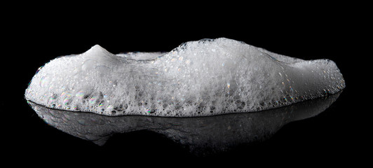 Soap foam Shaving cream bubble isolated on black background - obrazy, fototapety, plakaty