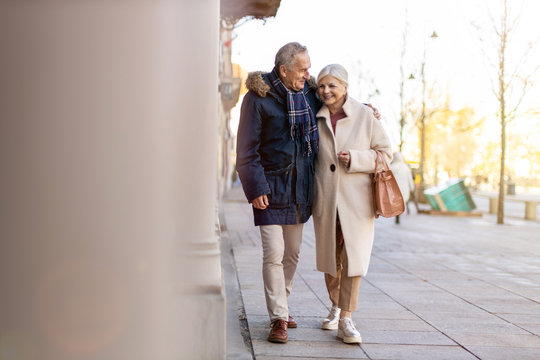 Senior Couple Walking On The City Street At Winter Day