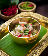 Spicy creamy coconut soup with chicken (Tom Kha Gai) on wood table,Thai food