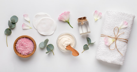 Spa background with natural cosmetic products on white