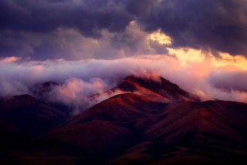 Mountain Wilderness with Clouds and Sunset Light