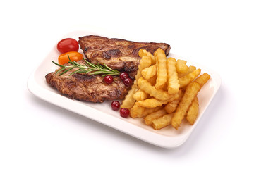 Grilled homemade pork ribs, barbecued meat with french fries, isolated on white background