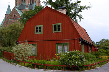 Traditional wooden house painted in traditional red located in Stockholm, Sweden