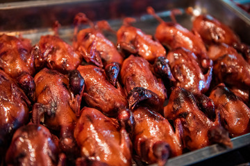 Fried pigeons in a food market in Beijing, China.