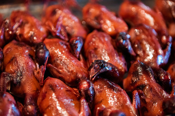 Fried pigeons in a food market in Beijing, China.