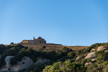 Fototapeta na wymiar Views of the top of Sant Llorenç del Munt and blue clean sky at La Mola, Catalunya